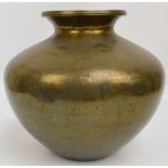 A large mid 19th century Eastern brass vase of squat baluster form with flared rim,