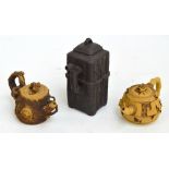 Two ornate modern Yixing teapots with gold labels to base,