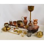 A group of metalware including a copper warming pan, a baluster jug, a brass teapot,