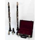 A cased Intermusic clarinet and a loose ebonised clarinet with replacement bell end (2).