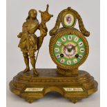 A French gilt metal mantel clock, the circular enamel dial set with Roman hour markers,