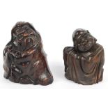 A Chinese rootwood carving depicting a seated elderly man wrapped in robes, height 13.