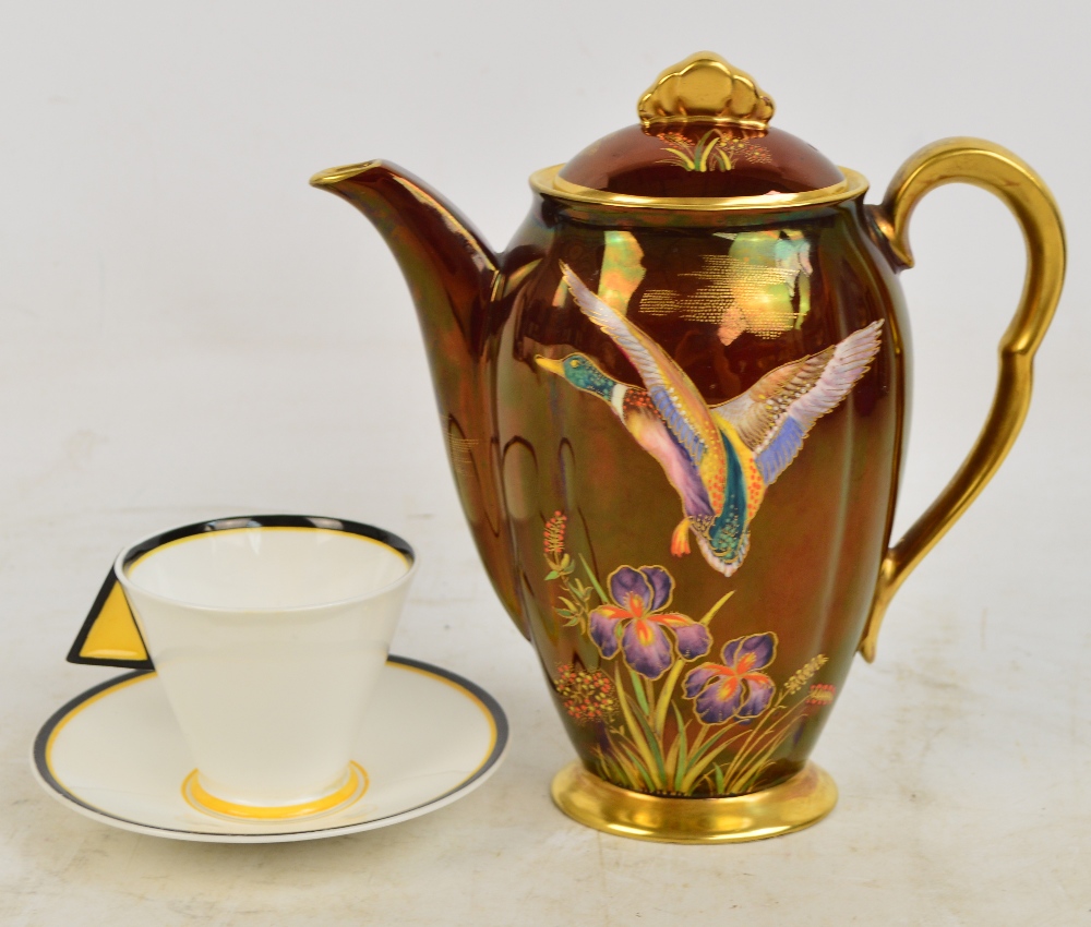 An Art Deco Shelley cup and saucer in the "Shelley Mode Yellow Blocks" pattern and a Carlton Ware