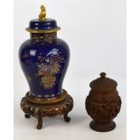 A Wiltshaw and Robinson Carlton Ware blue ground floral decorated ginger jar and cover raised on