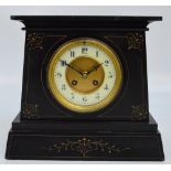 A late 19th century French black slate mantel clock with Arabic numerals to the circular chapter