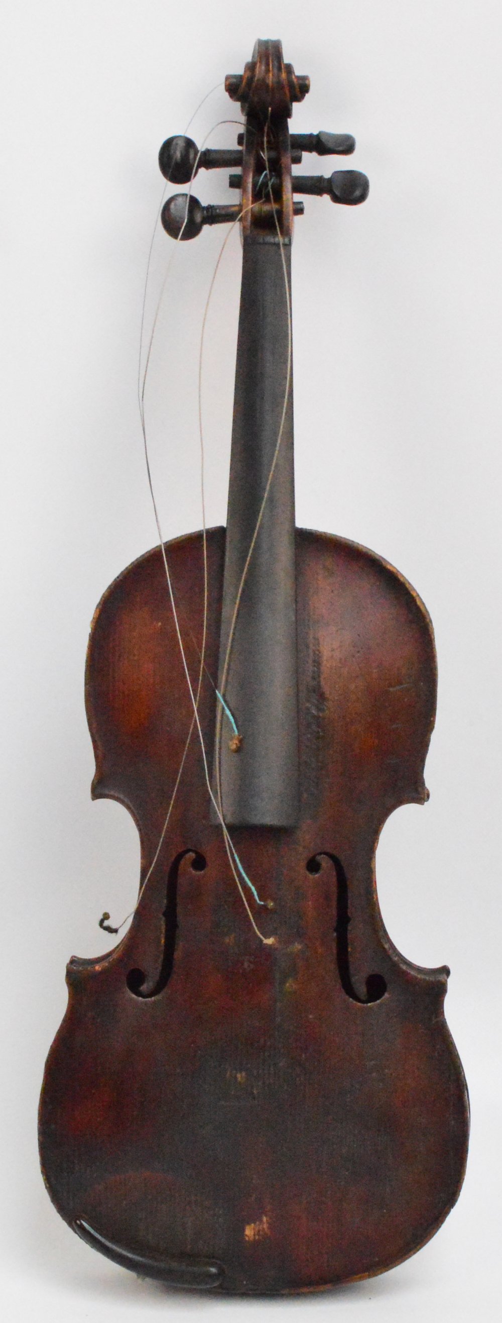 A full size violin with one-piece back, length of back 36cm, indistincly labelled, cased with a bow.