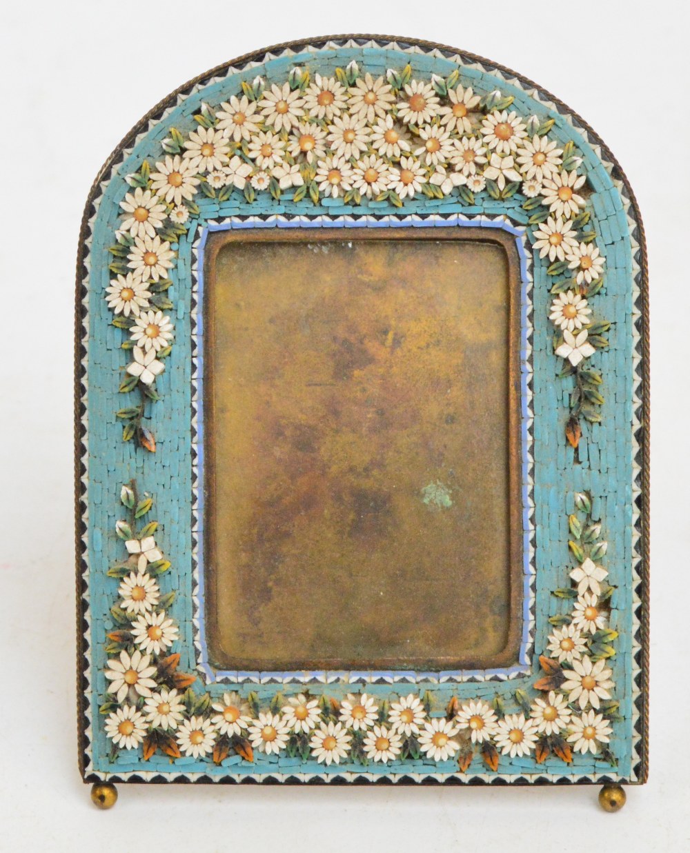 A late 19th century Italian micromosaic frame with arched top,