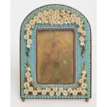 A late 19th century Italian micromosaic frame with arched top,