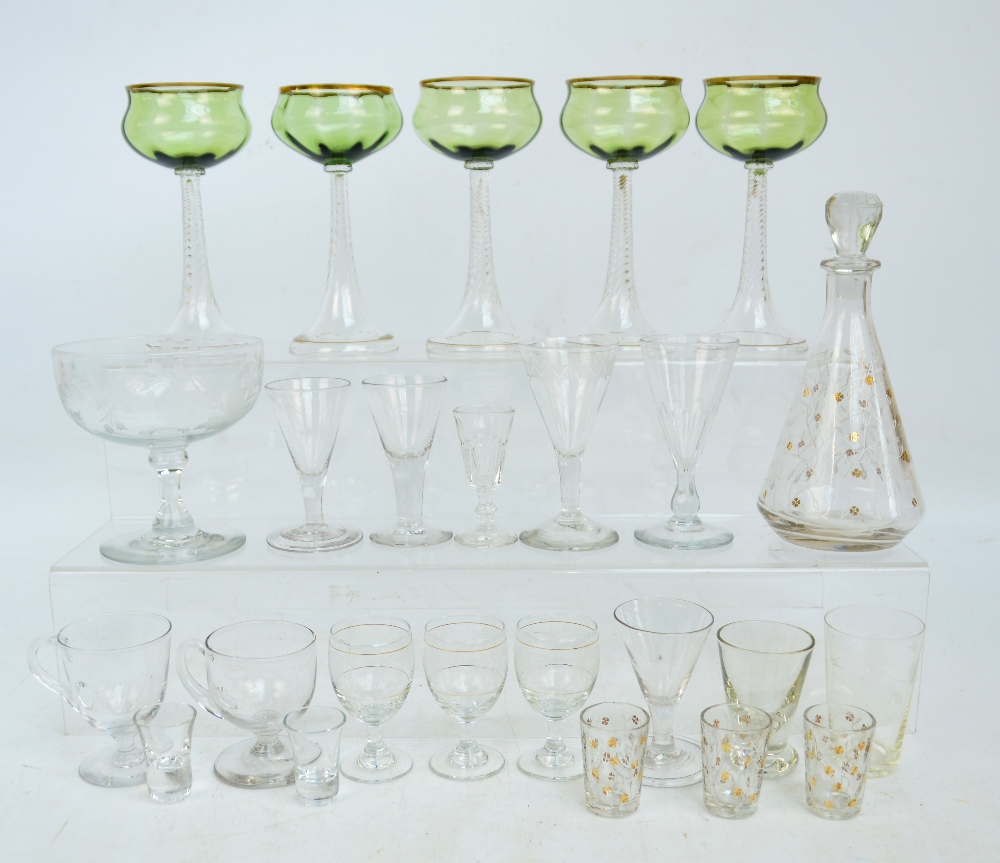 A collection of predominantly 19th century drinking glasses including a set of five green tinted