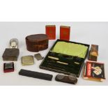 An early 20th century cased part manicure set, a leather cased brush, a pair of cased spectacles,