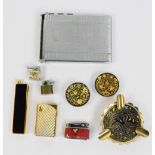 A Cosmic R cigarette lighter, a cigarette case, an ashtray,