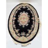 A quantity of modern Chinese super wash rugs, the majority with floral decoration.