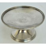 An American silver plated comport with husk decorated rim,