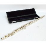 A cased silver plated flute, unbranded.