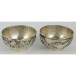 A pair of Chinese white metal bowls,