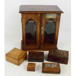 An early 20th century oak two door smoker's cabinet, and five small trinket boxes (6).