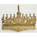 A 20th century brass Hanukkah lamp in the form of figures on Jerusalem wall holding sconces