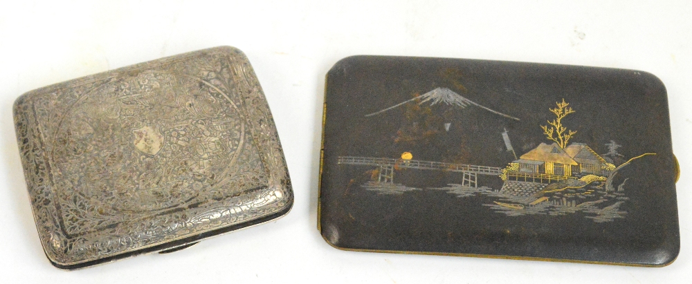 A Japanese Komai cigarette case of rounded rectangular form decorated with a river architectural