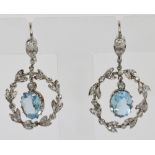 A pair of white metal diamond and aquamarine earrings,