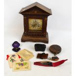 A collectors' lot including a mantel clock, a pair of opera glasses,