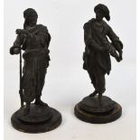 A pair of late 19th century spelter figures, one depicting a man carrying various swords,