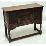A reproduction oak sideboard of small proportions