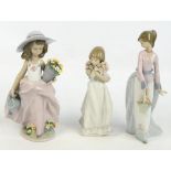 Three Lladro figures of various girls holding flowers (3).