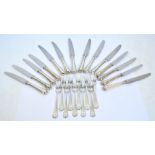 A set of six silver plate handled table knives, a matching set of six smaller examples,