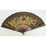 A late 19th century French folding fan with faux tortoiseshell guards and sticks set with metal
