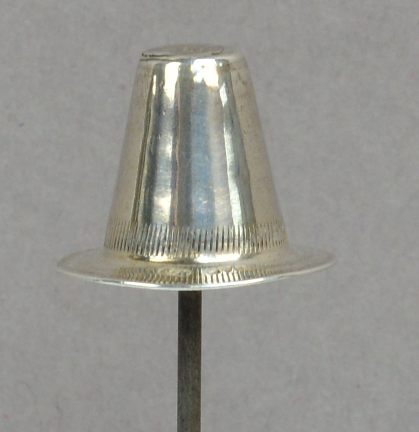 A Charles Horner hallmarked silver hat pin in the form of a Welsh hat with striped decoration to