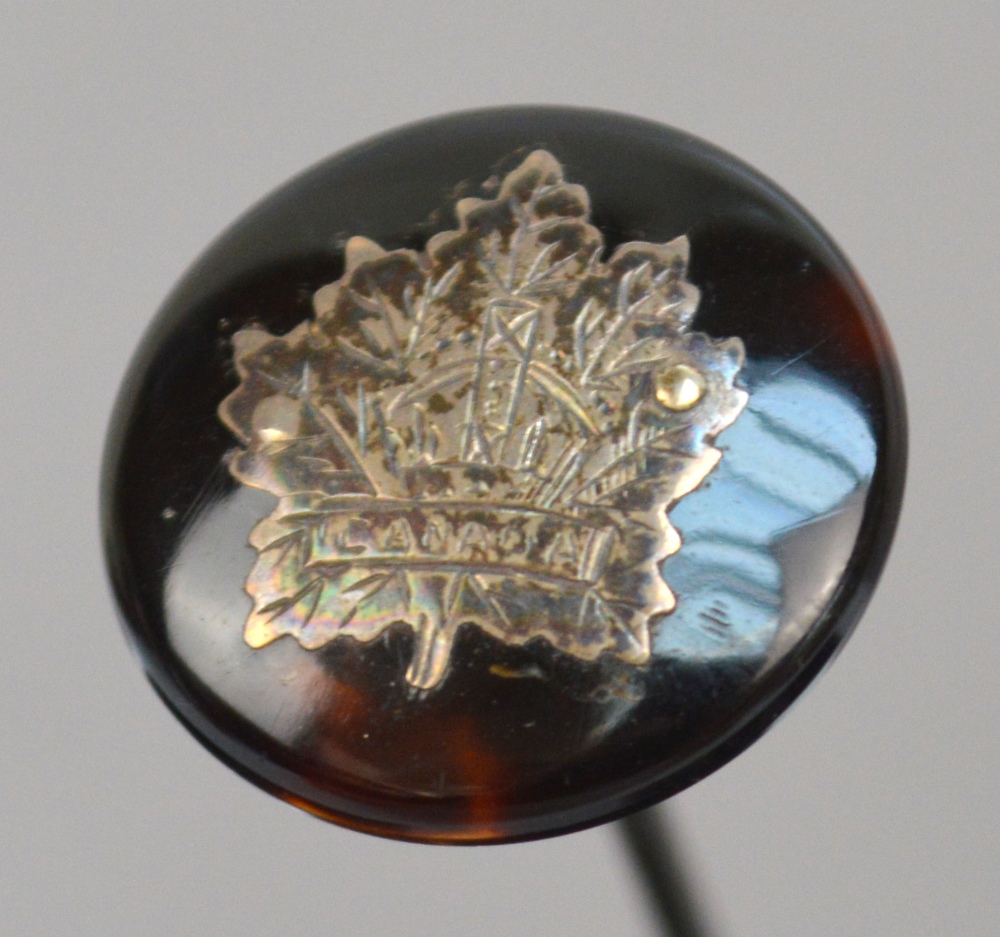 A sterling silver circular hat pin,