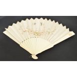 A late 19th century Canton folding fan with shaped ivory guards with small carved oval floral
