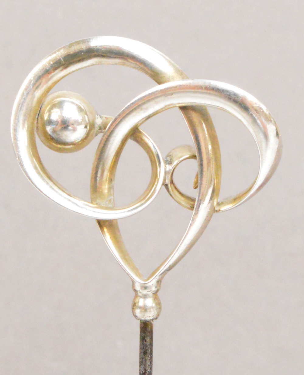 A Charles Horner 925 standard silver hat pin of abstract form with a ball and looped ribbon, - Image 2 of 2