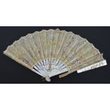 A 19th century folding fan, with inlaid and pierced mother of pearl guards and sticks,