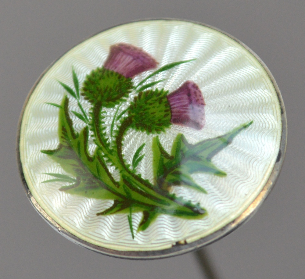 A George V hallmarked silver hat pin of circular form decorated in suffragette colours with two
