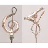 A Charles Horner hallmarked silver hat pin in the form of a treble clef, Chester 1909,