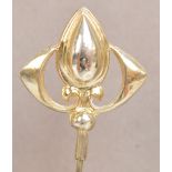 A George V hallmarked silver hat pin of pear shaped form with wings to either side,