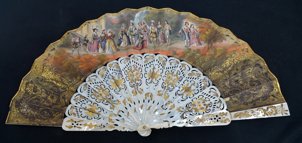 A early 19th century double sided Spanish folding fan with pierced shaped and metal inlaid guards