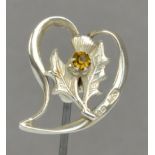 A Charles Horner hallmarked silver hat pin in the form of a thistle set with a citrine coloured