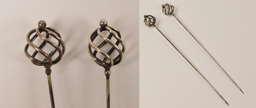 A pair of Charles Horner hallmarked silver hat pins in the form of swirl spheres with finials,