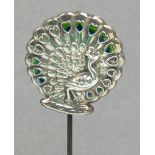 An Edward VII hallmarked silver hat pin in the form of a peacock with residual enamel to the eyes