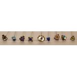 A collection of nine Heraldic hat pins bearing various coats of arms and town crests,