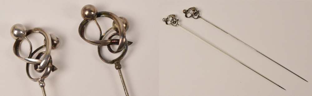 A pair of Charles Horner hallmarked silver hat pins of looping design, each with applied balls,