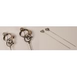 A pair of Charles Horner hallmarked silver hat pins of looping design, each with applied balls,