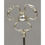 A Charles Horner hallmarked silver hat pin in the form of a ball surrounded by a ribbon in a