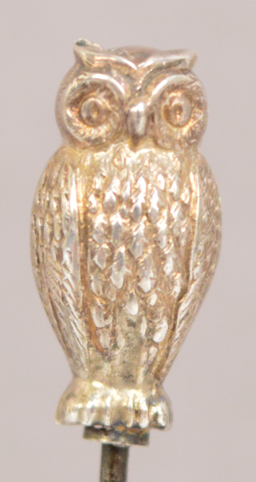 A small hallmarked silver hat pin in the form of an owl, Arthur Johnson Smith,