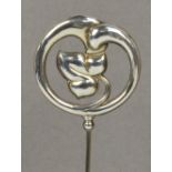 A Charles Horner hallmarked silver hat pin in the form of an ivy leaf within a circular organic