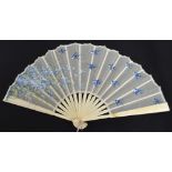A small French folding fan with carved ivory guards and matching sticks with bone edged rivet and