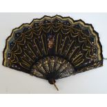 A late 19th century English fontange shaped quizzing fan,