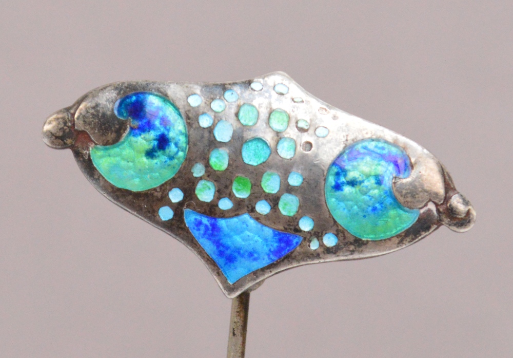 An Edward VII hallmarked silver and blue/green enamel Arts and Crafts hat pin in the form of a